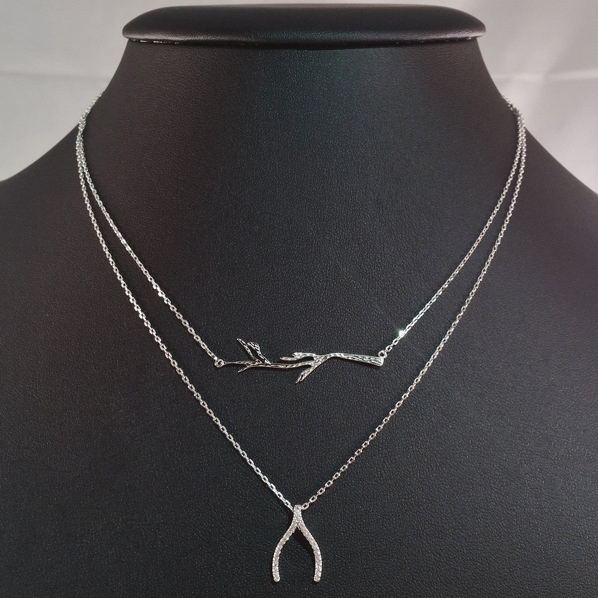 925 STERLING SILVER DOUBLE LAYER NECKLACE WITH CRYSTAL WISHBONE AND TREE BRANCH PENDANT.