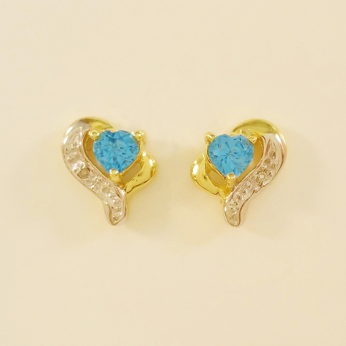 9K SOLID GOLD 0.45CT SWISS BLUE TOPAZ AND DIAMOND STUD EARRINGS.