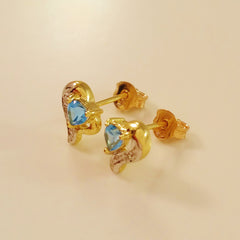 9K SOLID GOLD 0.45CT SWISS BLUE TOPAZ AND DIAMOND STUD EARRINGS.