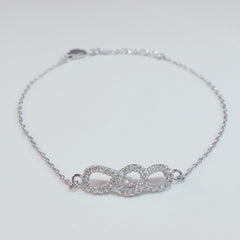925 STERLING SILVER BRACELET WITH INFINITY CHARM PAVED WITH  SPARKLING CZ CRYSTALS.