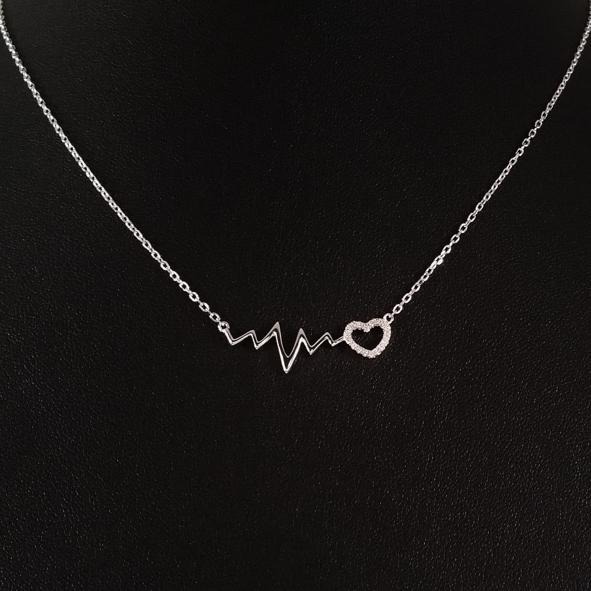 925 STERLING SILVER NECKLACE WITH EKG HEARTBEAT AND LOVE-HEART PENDANT SET IN SPARKLING CRYSTALS.