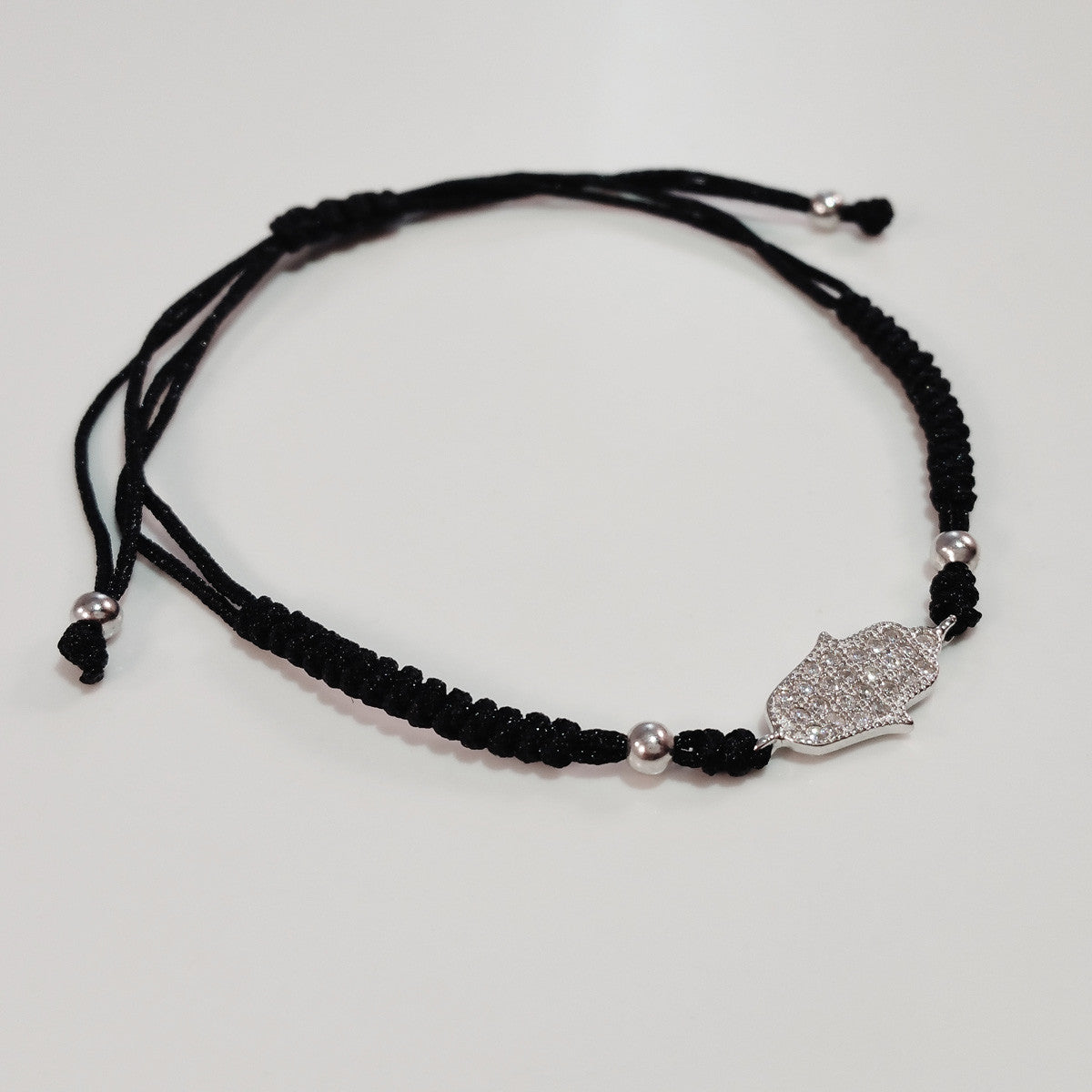 925 STERLING SILVER CZ CRYSTAL HAMSA HAND ON THREADED BRAIDED BRACELET.