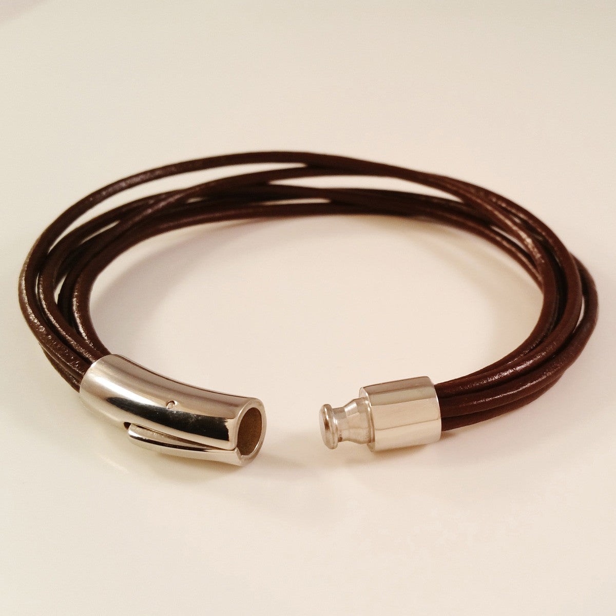 MEN'S MULTI LAYER COW HIDE LEATHER BRACELET WITH STAINLESS STEEL CLASP.