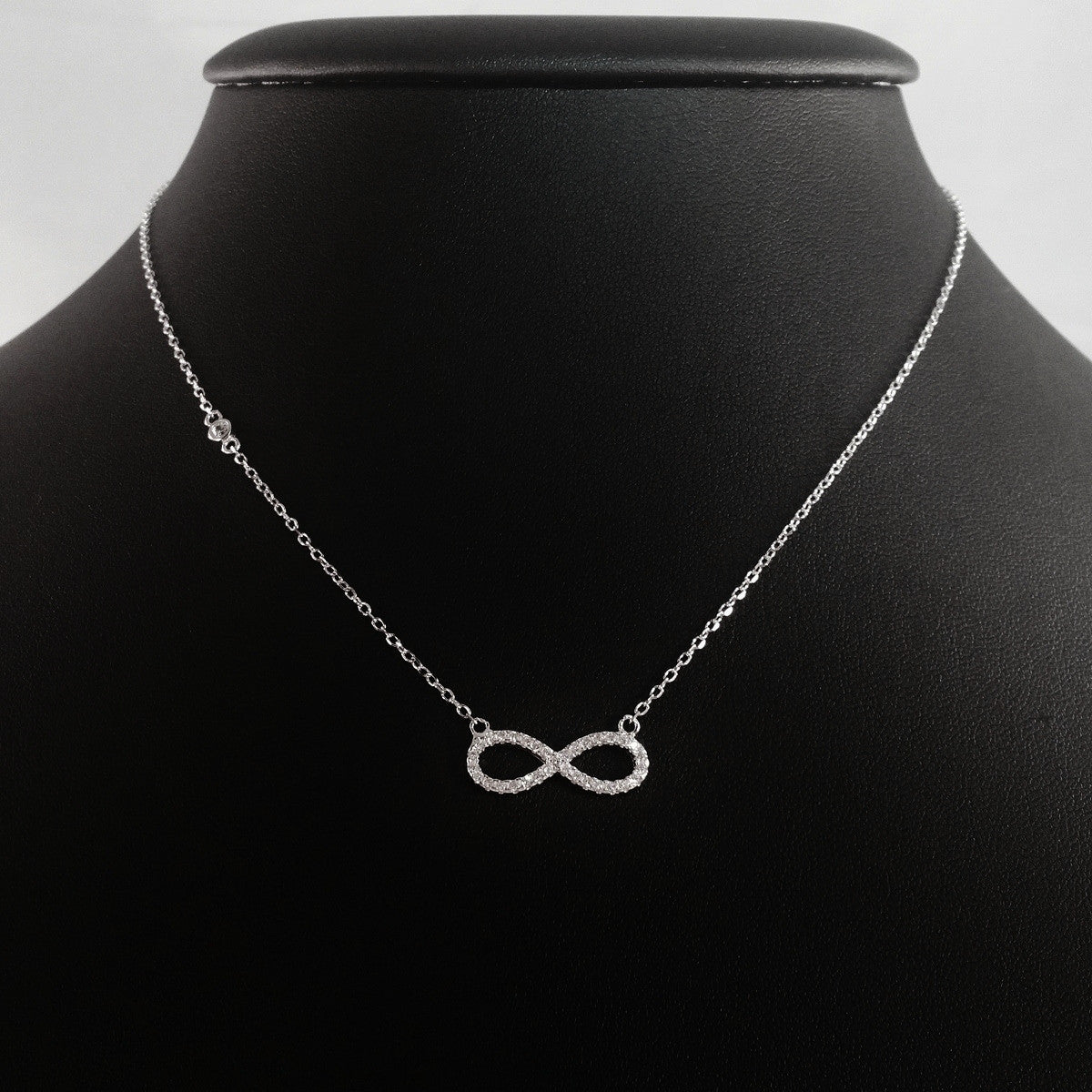 925 STERLING SILVER NECKLACE WITH ETERNITY PENDANT SET IN SPARKLING CRYSTALS.