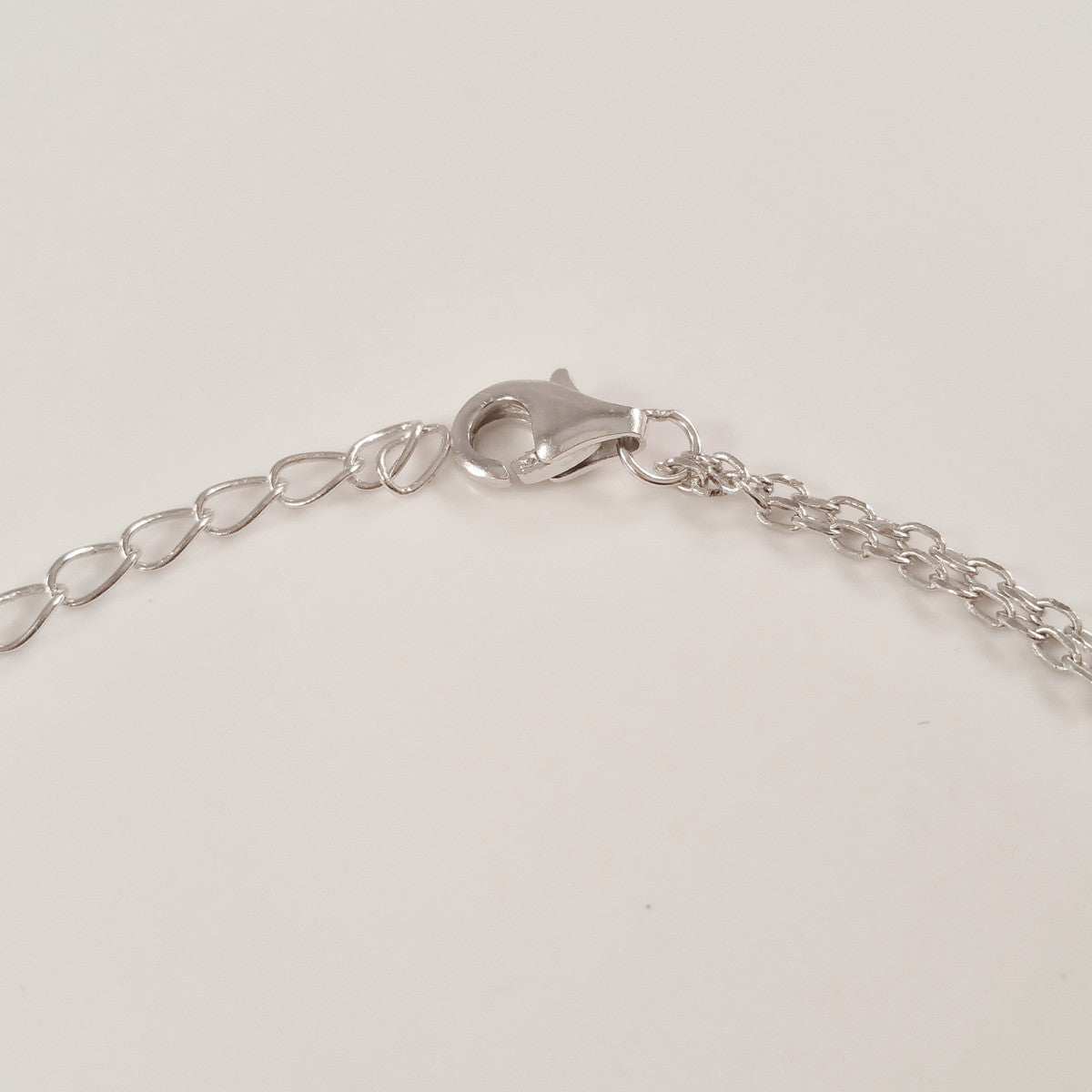 925 STERLING SILVER BRACELET WITH ANGEL WINGS CHARM PAVED WITH SPARKLING CZ CRYSTALS.