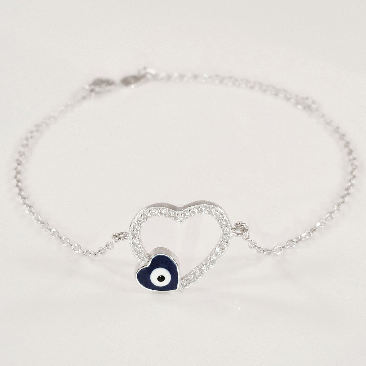 925 STERLING SILVER BRACELET WITH OPEN HEART EVIL EYE CHARM PAVED WITH SPARKLING CZ CRYSTALS.