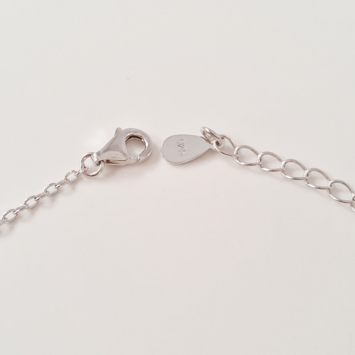 925 STERLING SILVER BRACELET WITH OPEN HEART EVIL EYE CHARM PAVED WITH SPARKLING CZ CRYSTALS.
