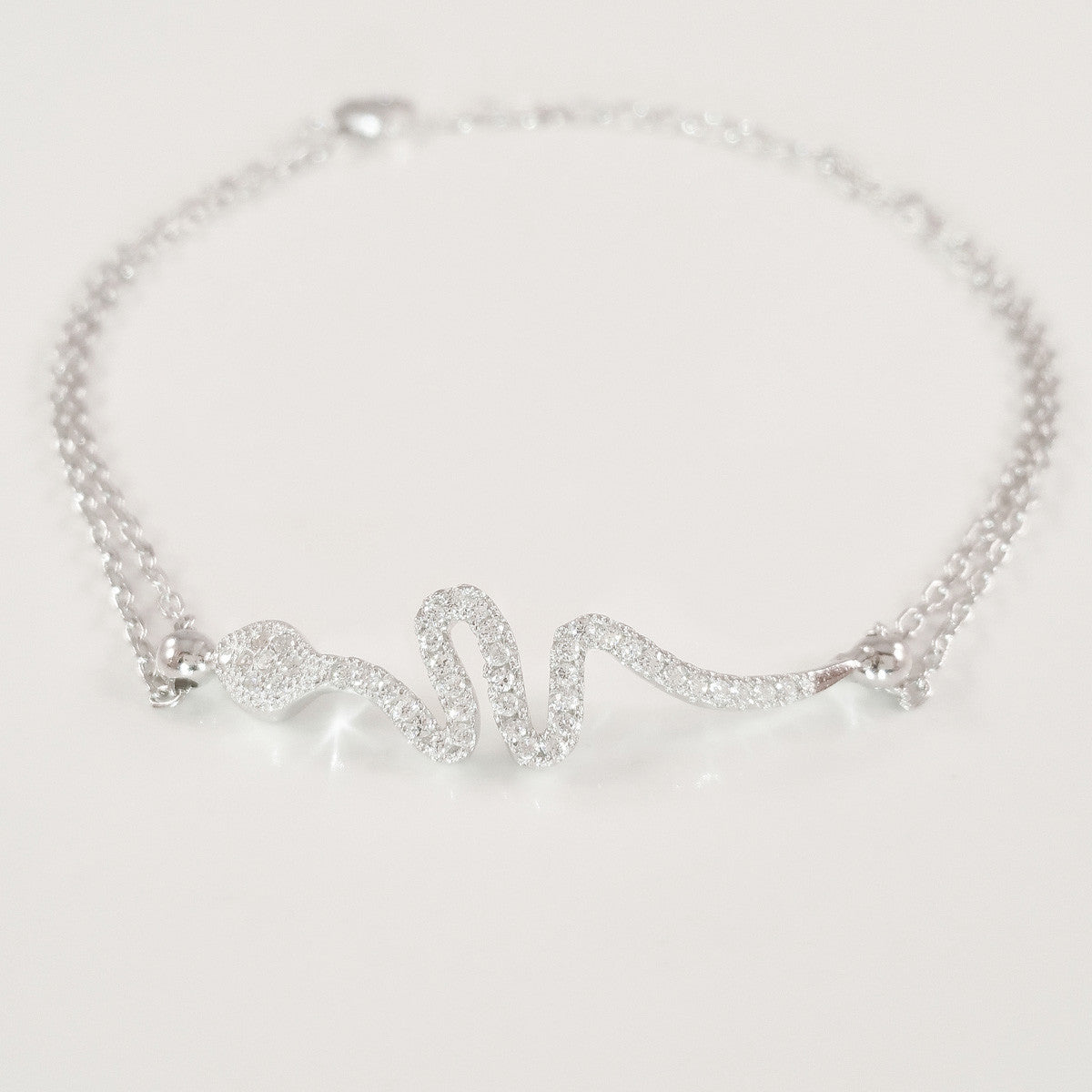 925 STERLING SILVER BRACELET WITH SNAKE CHARM PAVED WITH SPARKLING CZ CRYSTALS.