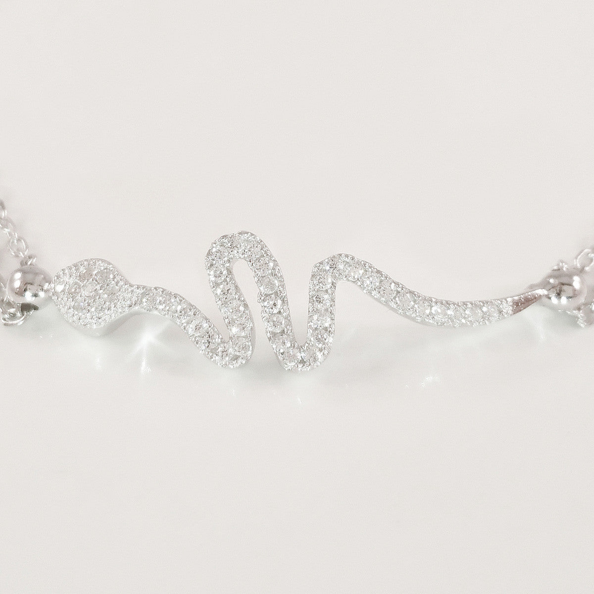 925 STERLING SILVER BRACELET WITH SNAKE CHARM PAVED WITH SPARKLING CZ CRYSTALS.