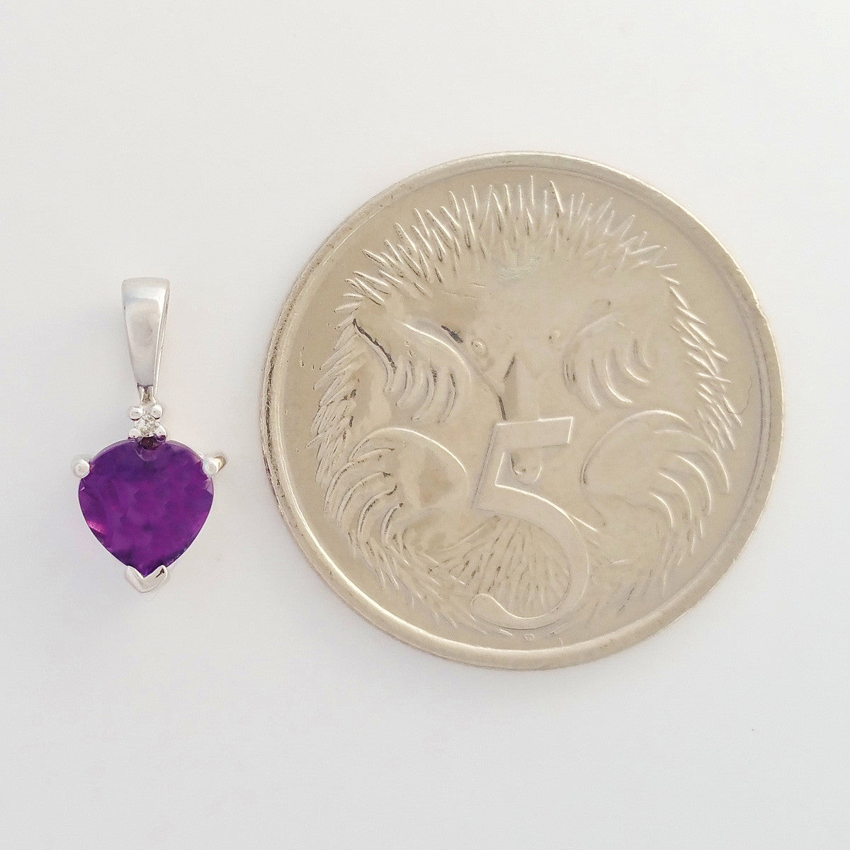 9K SOLID WHITE GOLD 0.50CT NATURAL AMETHYST AND DIAMOND PENDANT.