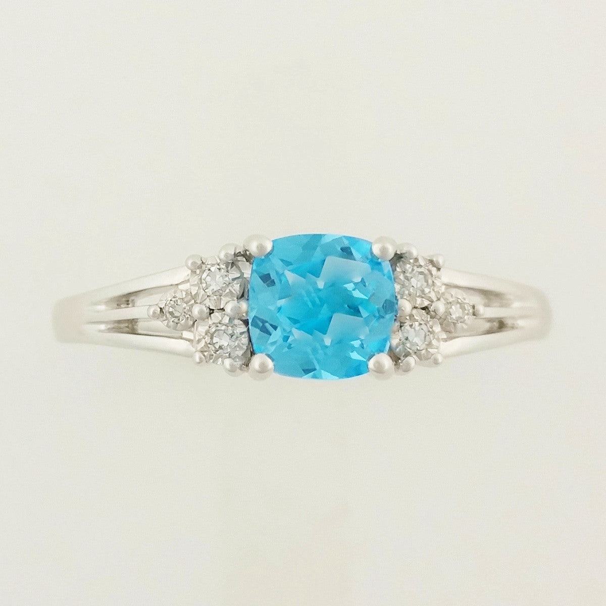 9K SOLID WHITE GOLD 0.60CT NATURAL BLUE TOPAZ RING WITH 6 DIAMONDS.