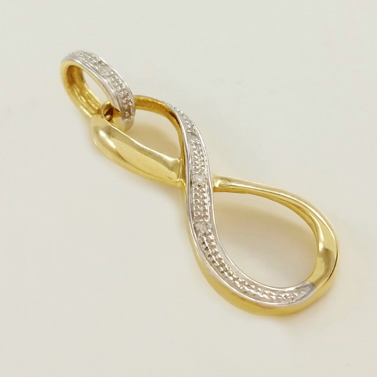 9K SOLID GOLD 0.02CT INFINITY ETERNITY PENDANT WITH 4 DIAMONDS.