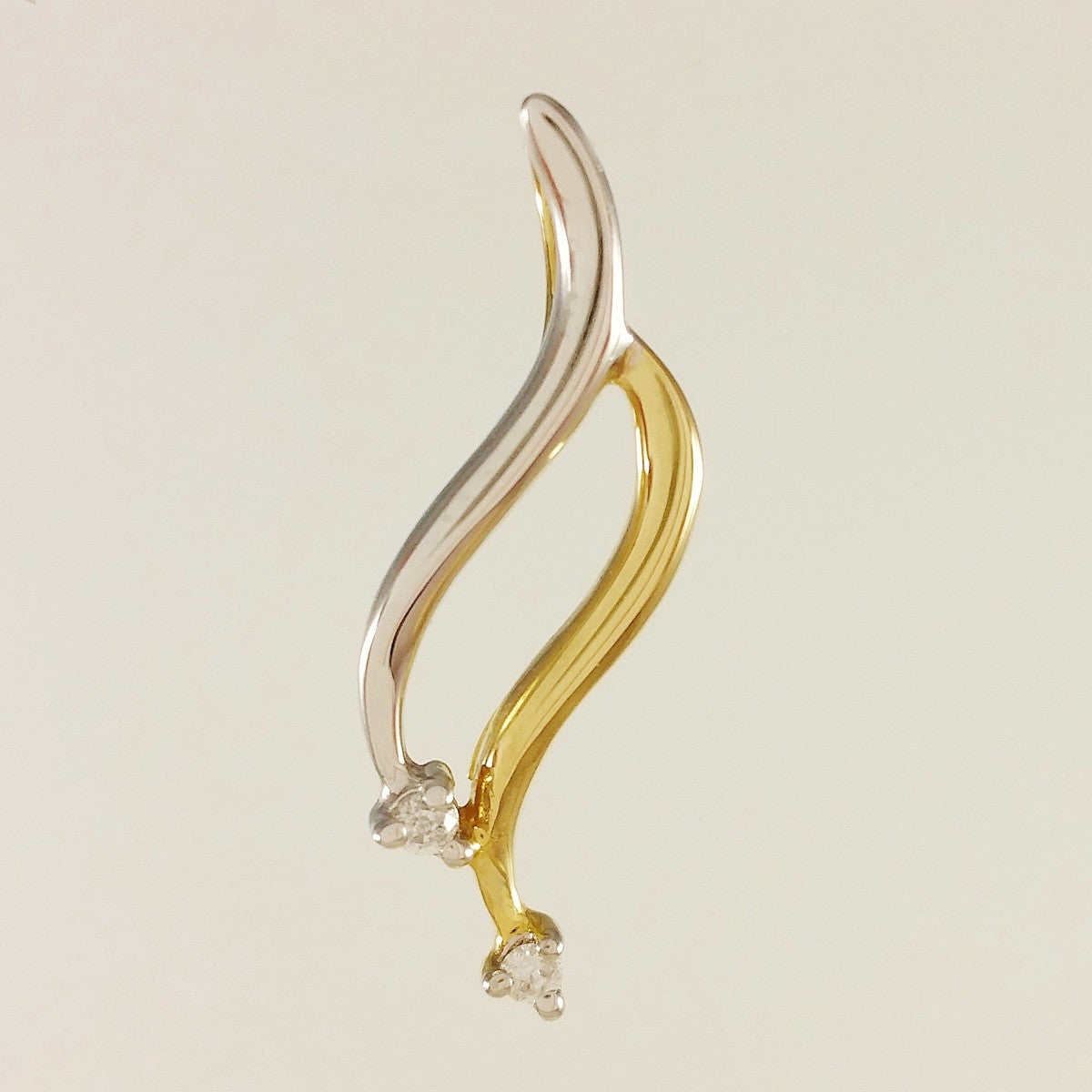 9K SOLID YELLOW AND WHITE GOLD PENDANT WITH TWO DIAMONDS.