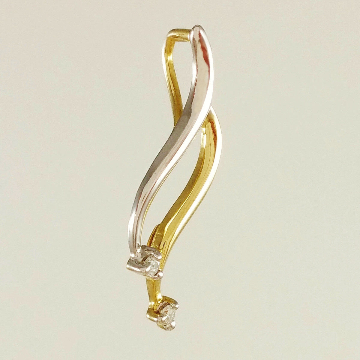 9K SOLID YELLOW AND WHITE GOLD PENDANT WITH TWO DIAMONDS.
