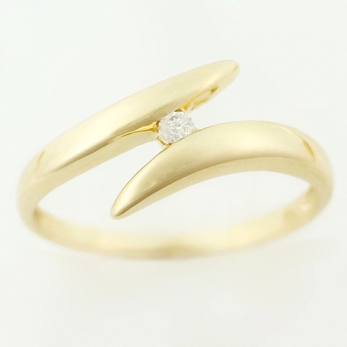 9K SOLID 0.03CT BYPASS DESIGN DIAMOND SOLITAIRE RING.