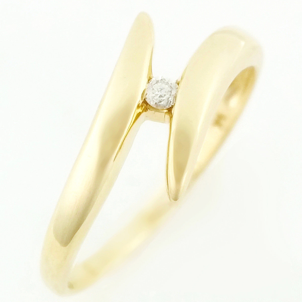 9K SOLID 0.03CT BYPASS DESIGN DIAMOND SOLITAIRE RING.