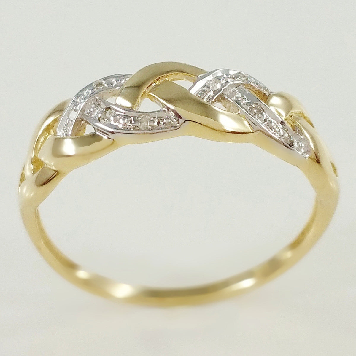 9K SOLID GOLD ENDLESS KNOT CELTIC BAND RING WITH 8 DIAMONDS.