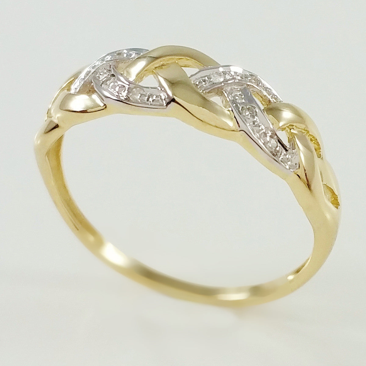 9K SOLID GOLD ENDLESS KNOT CELTIC BAND RING WITH 8 DIAMONDS.