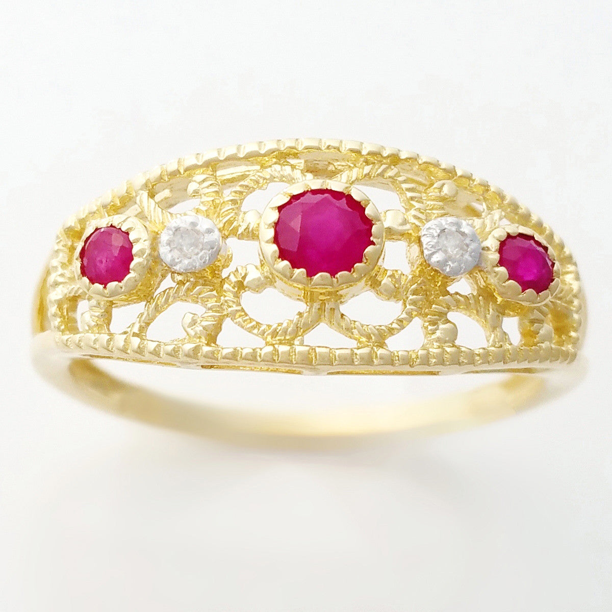 9K SOLID GOLD 0.30CT NATURAL RUBY NAVETTE STYLE RING WITH 2 DIAMONDS.