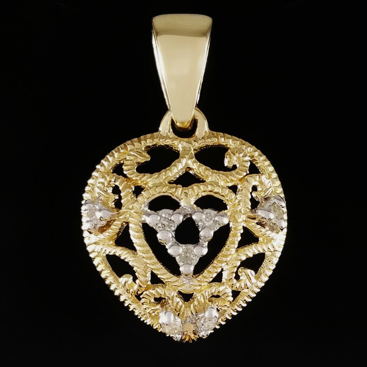 9K SOLID GOLD FILIGREE HEART PENDANT WITH 7 DIAMONDS.