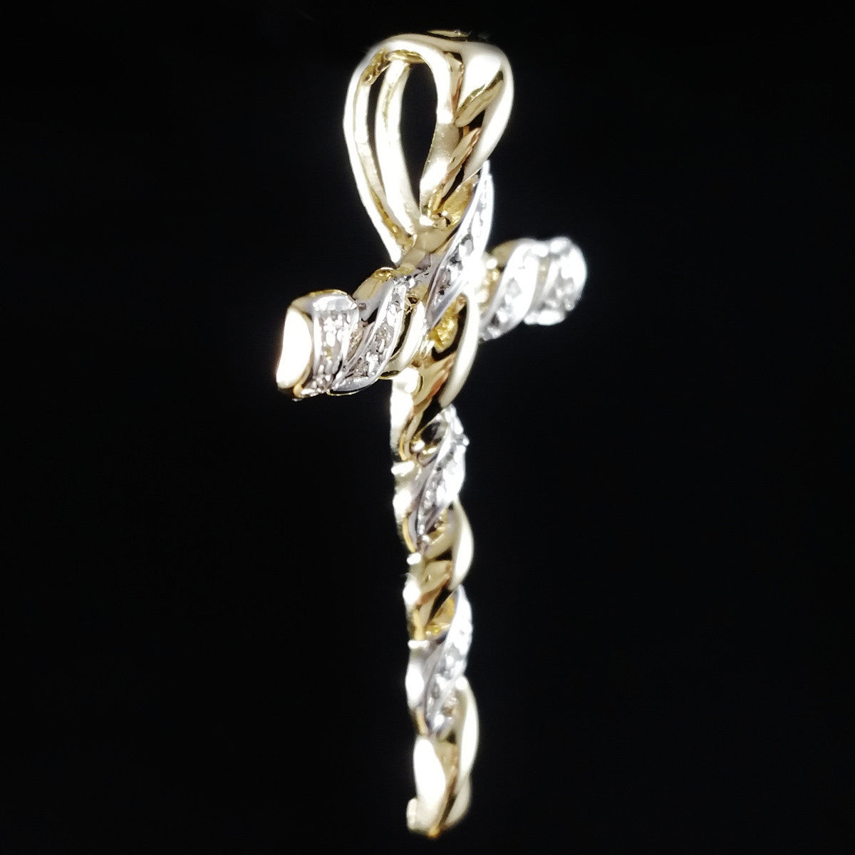 9K SOLID GOLD CROSS PENDANT WITH 7 DIAMONDS.