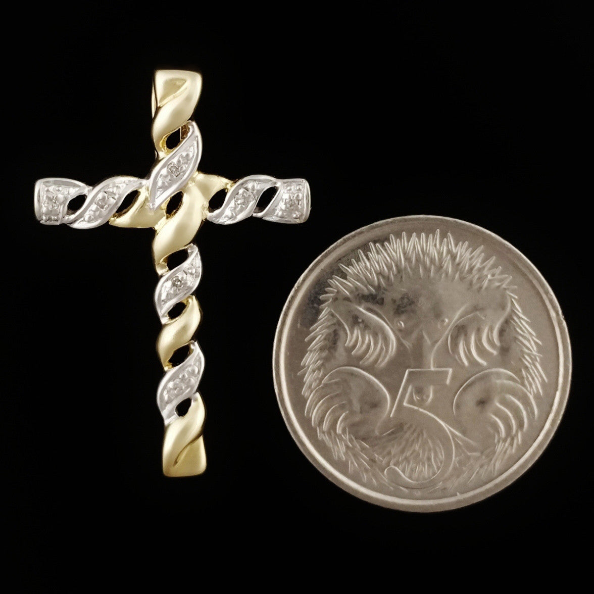 9K SOLID GOLD CROSS PENDANT WITH 7 DIAMONDS.
