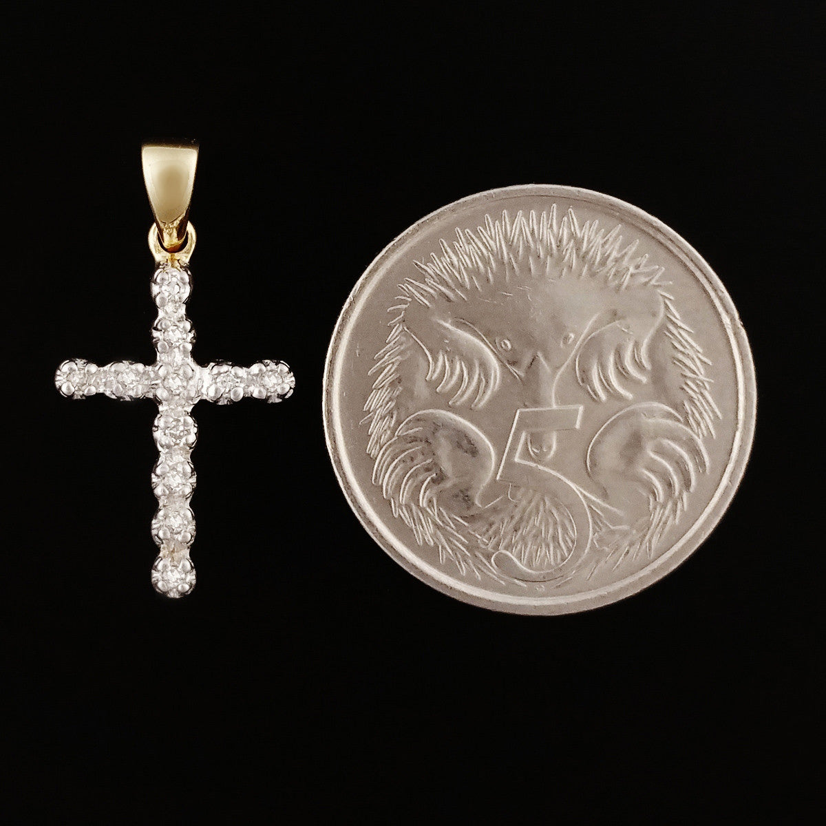 9K SOLID GOLD CROSS PENDANT WITH 11 DIAMONDS.
