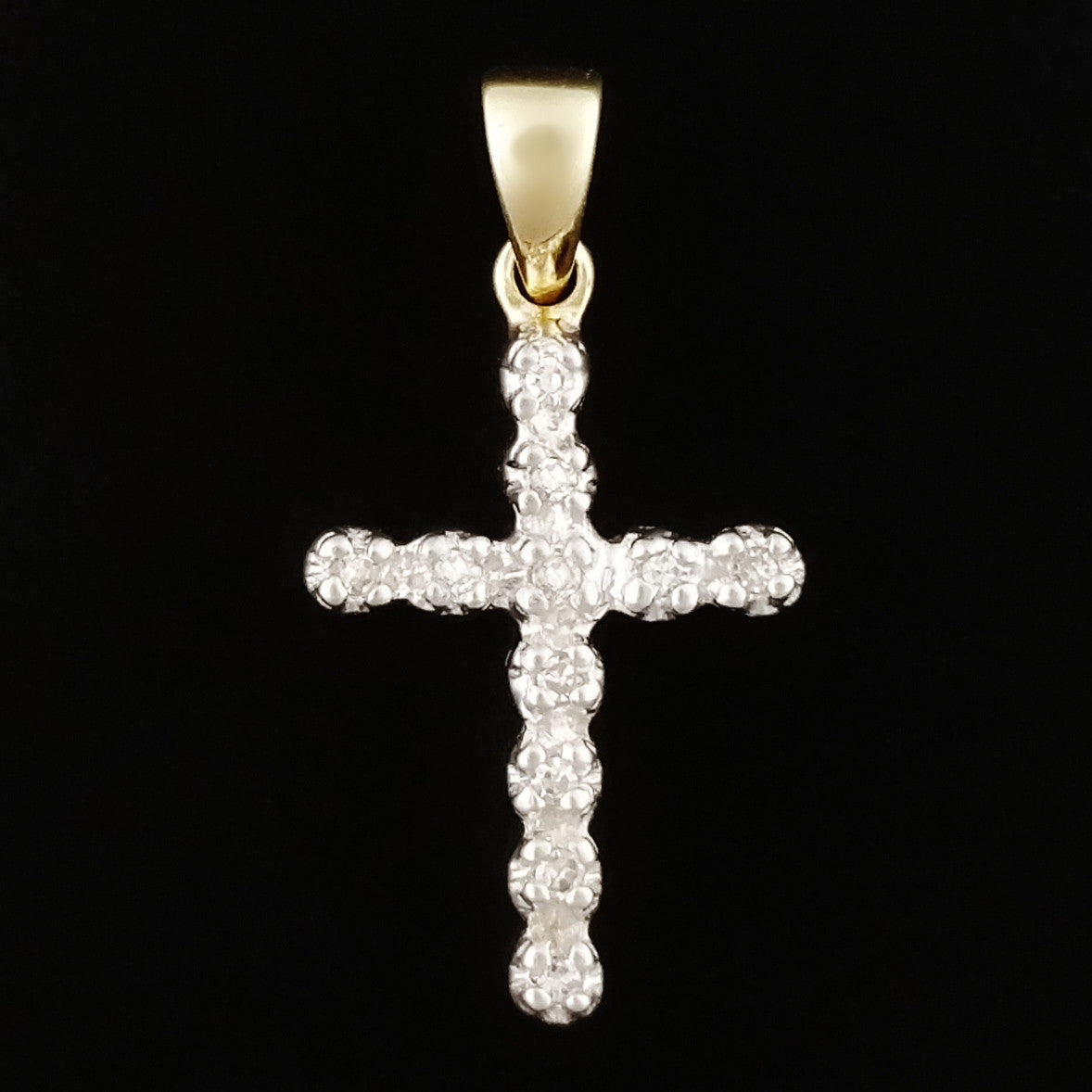 9K SOLID GOLD CROSS PENDANT WITH 11 DIAMONDS.