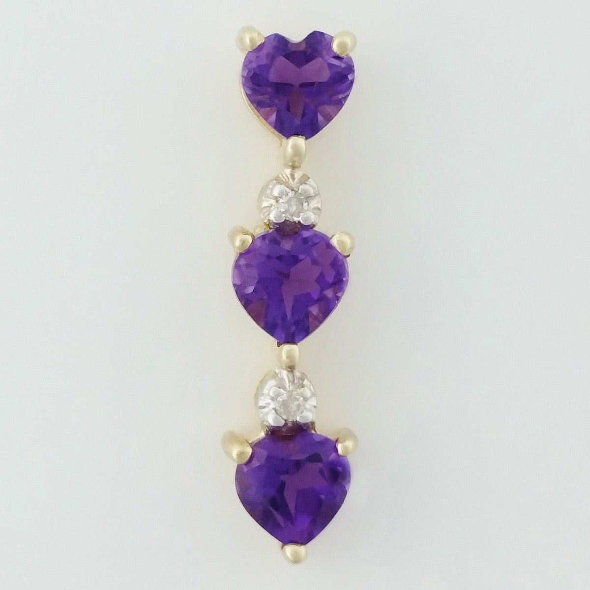 9K SOLID GOLD 0.70CT NATURAL AMETHYST PENDANT WITH 2 DIAMONDS.