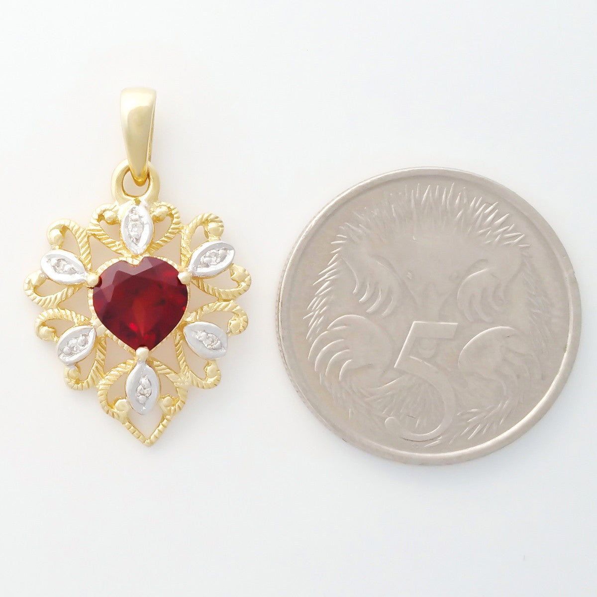 9K SOLID GOLD 0.95CT ALMANDINE GARNET FILIGREE PENDANT WITH 6 DIAMONDS.