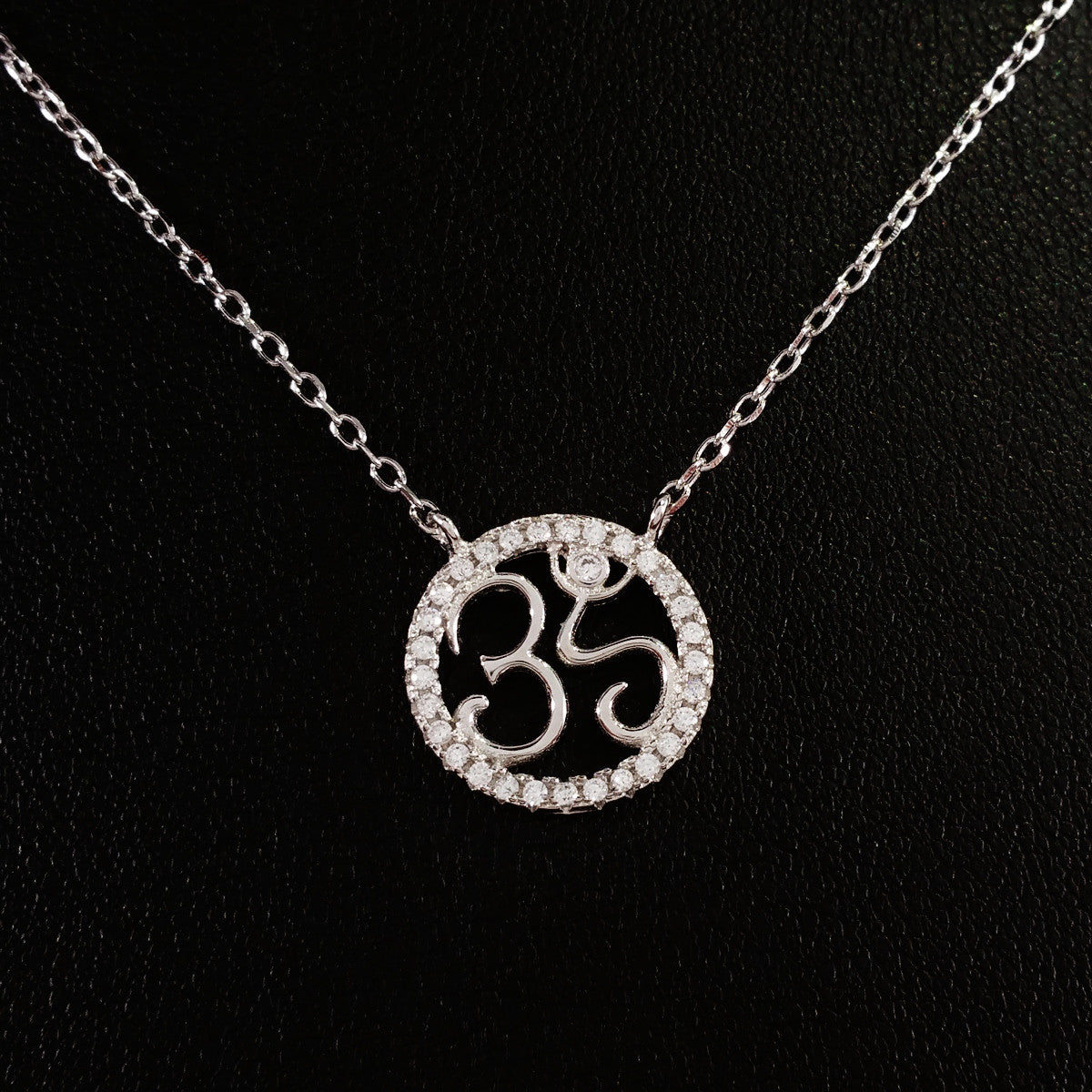 925 STERLING SILVER NECKLACE WITH OM NAMASTE PENDANT SET IN SPARKLING CRYSTALS.