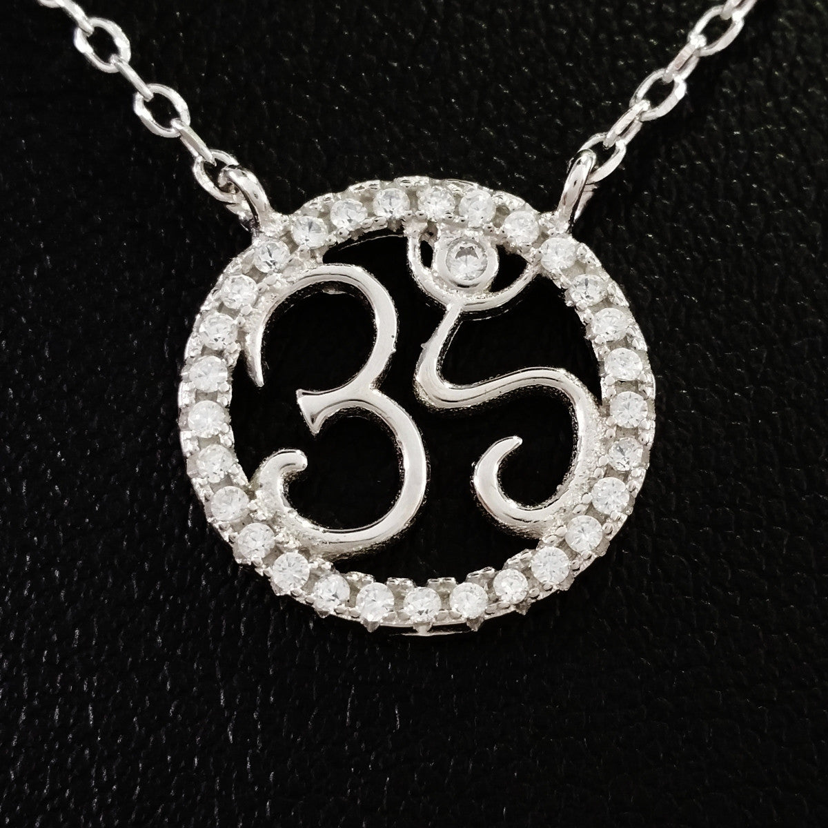 925 STERLING SILVER NECKLACE WITH OM NAMASTE PENDANT SET IN SPARKLING CRYSTALS.