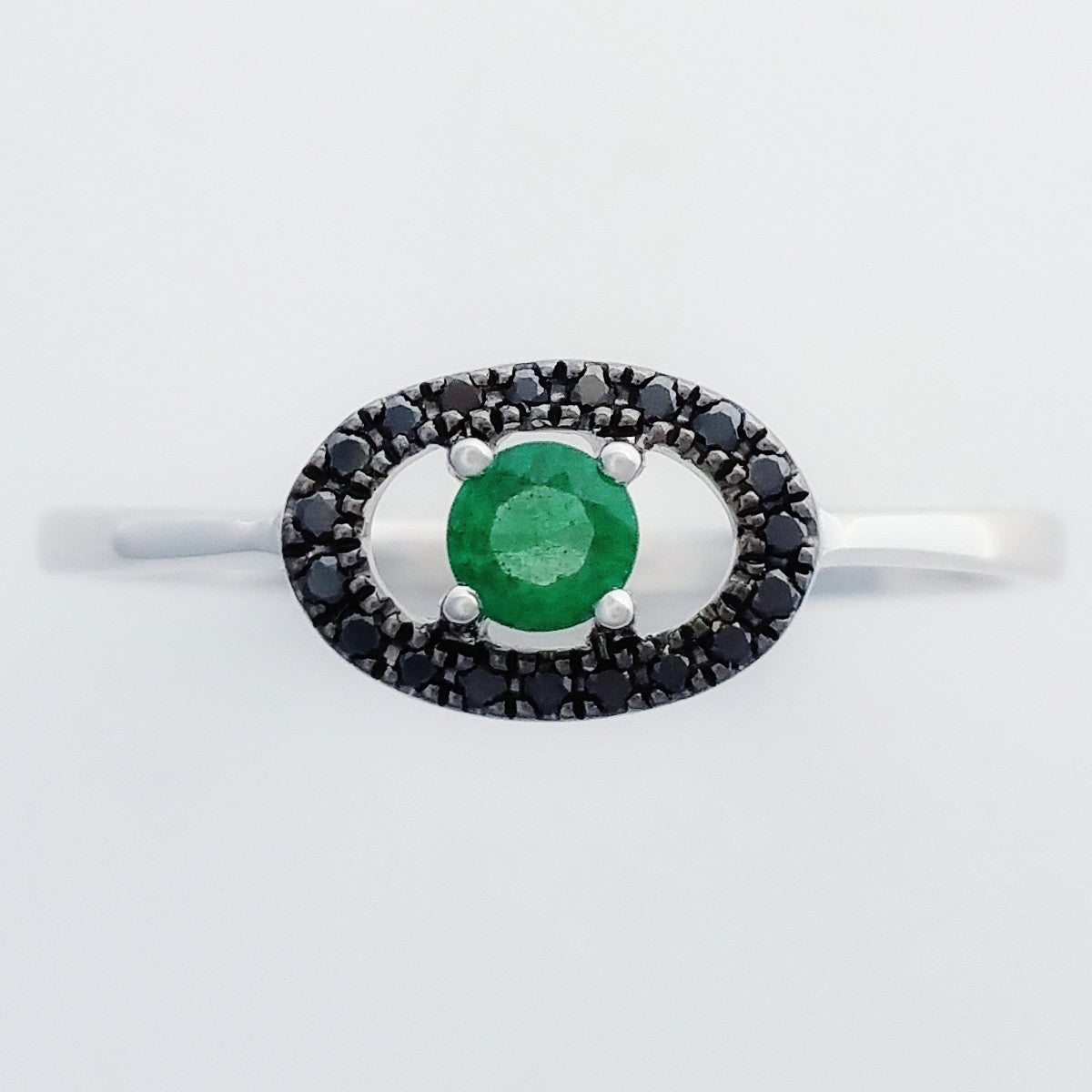 9K SOLID WHITE GOLD 0.15CT NATURAL EMERALD AND 19 BLACK DIAMOND RING.