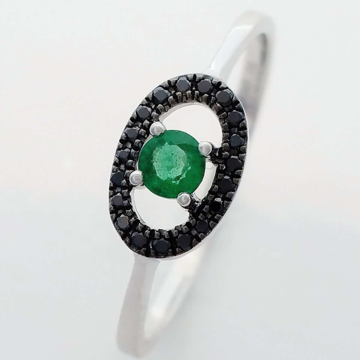9K SOLID WHITE GOLD 0.15CT NATURAL EMERALD AND 19 BLACK DIAMOND RING.