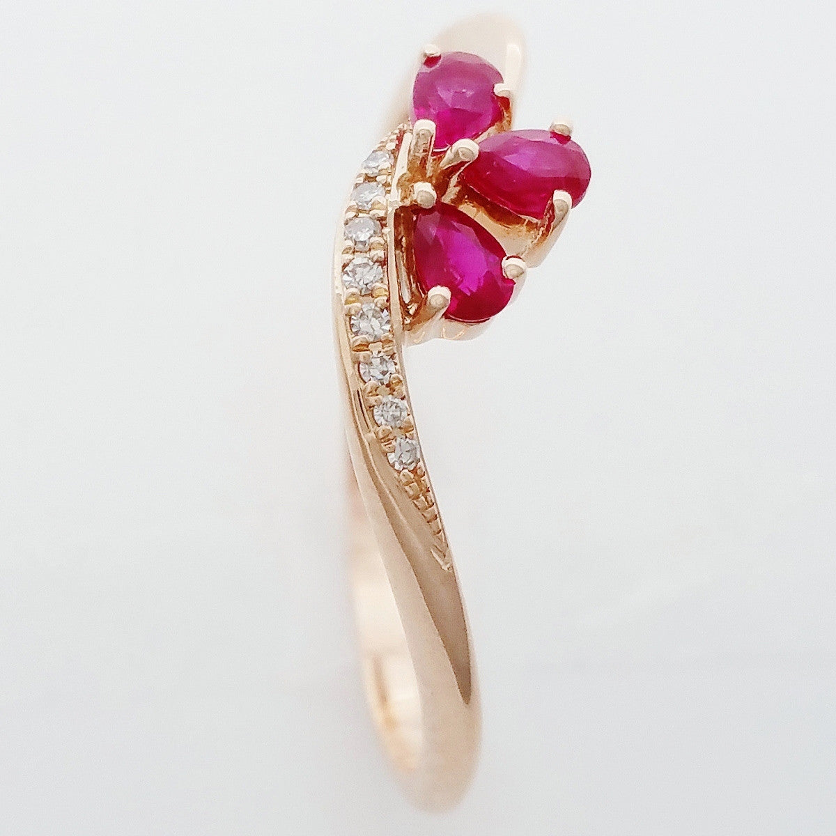 9K SOLID ROSE GOLD 0.20CT NATURAL RUBY CLUSTER RING WITH 8 DIAMONDS.