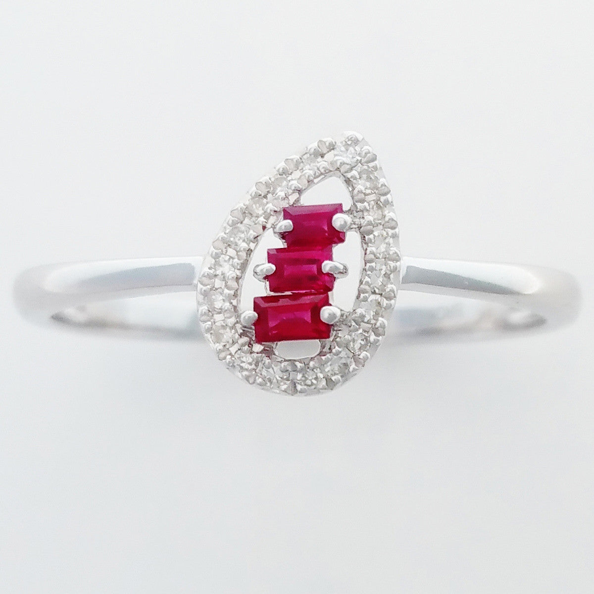 9K SOLID WHITE GOLD NATURAL BAGUETTE RUBY RING WITH 18 DIAMONDS.