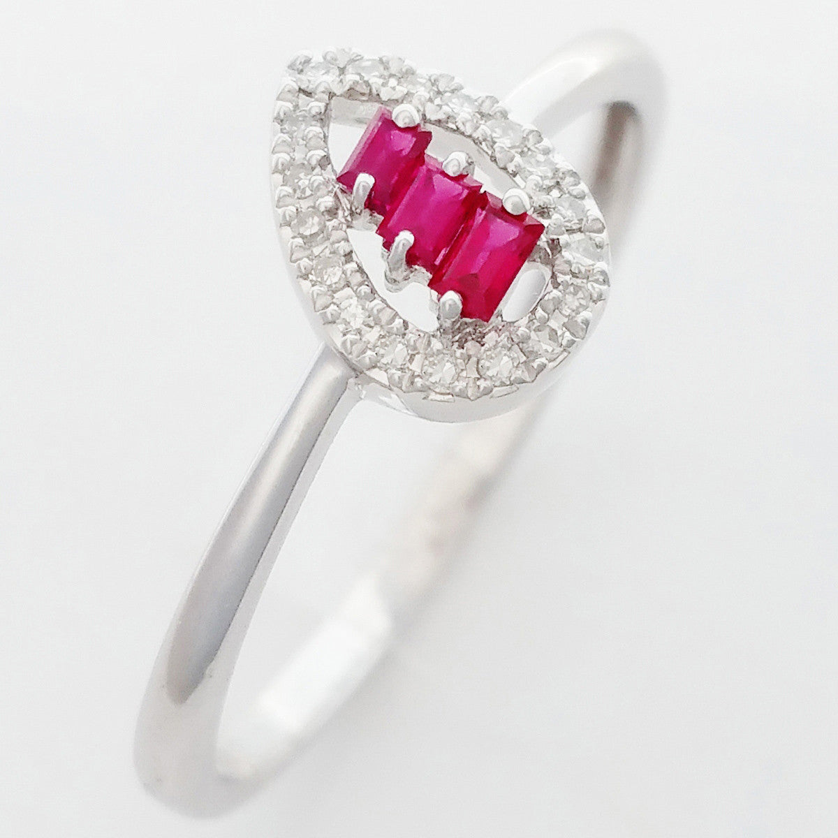 9K SOLID WHITE GOLD NATURAL BAGUETTE RUBY RING WITH 18 DIAMONDS.