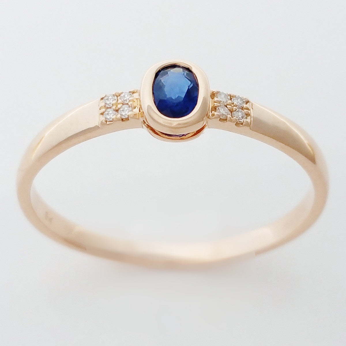 9K SOLID ROSE GOLD 0.20CT NATURAL OVAL BLUE SAPPHIRE RING WITH 8 DIAMONDS.