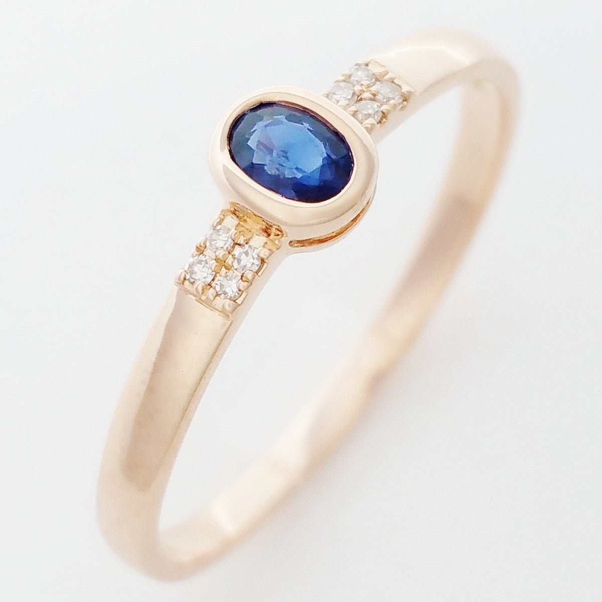 9K SOLID ROSE GOLD 0.20CT NATURAL OVAL BLUE SAPPHIRE RING WITH 8 DIAMONDS.
