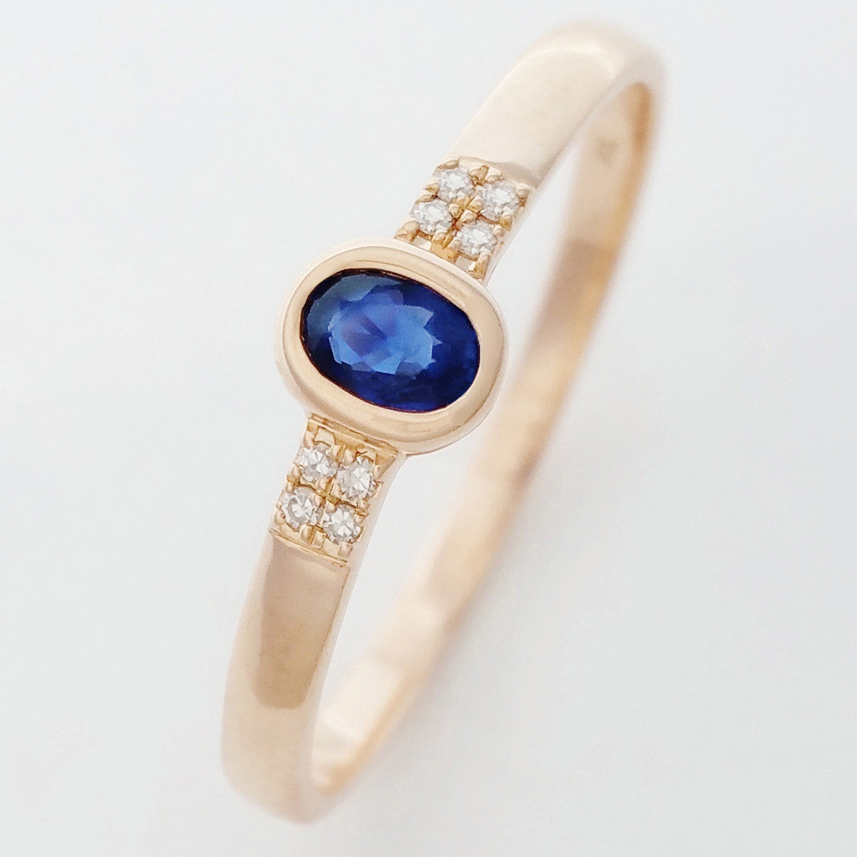9K SOLID ROSE GOLD 0.20CT NATURAL OVAL BLUE SAPPHIRE RING WITH 8 DIAMONDS.
