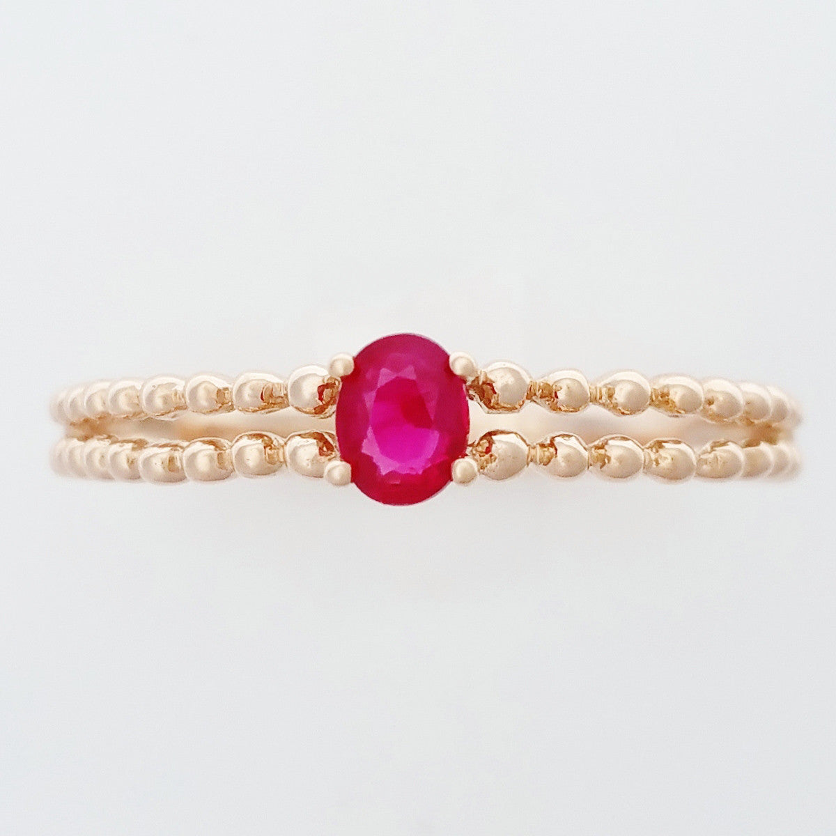 9K SOLID ROSE GOLD 0.25CT NATURAL RUBY RING WITH BEADED SHOULDERS.