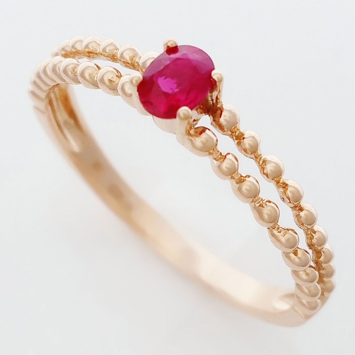 9K SOLID ROSE GOLD 0.25CT NATURAL RUBY RING WITH BEADED SHOULDERS.