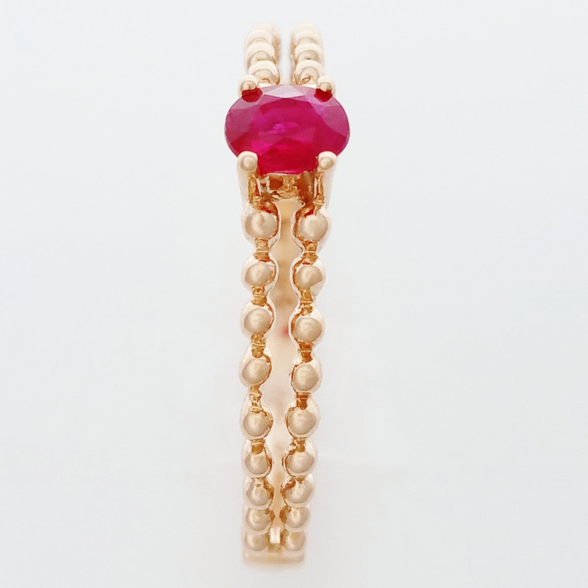 9K SOLID ROSE GOLD 0.25CT NATURAL RUBY RING WITH BEADED SHOULDERS.