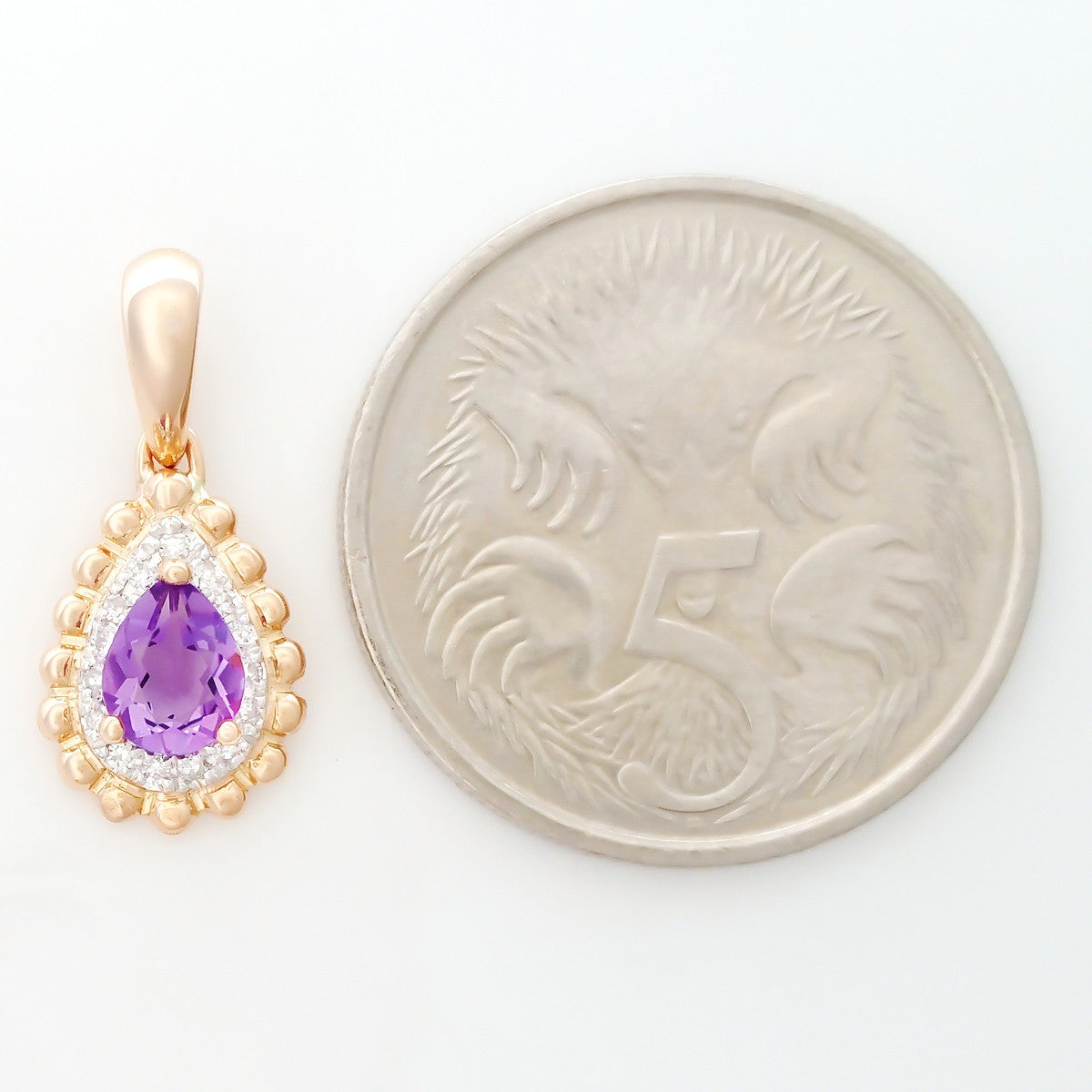 9K SOLID ROSE GOLD 0.30CT NATURAL PURPLE AMETHYST PENDANT WITH 15 DIAMONDS.