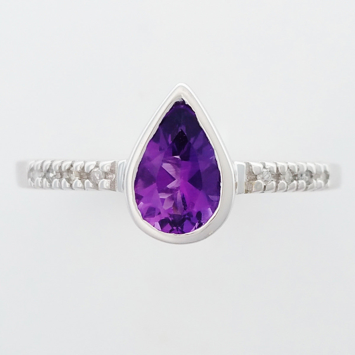 9K SOLID WHITE GOLD 0.70CT NATURAL PEAR CUT AMETHYST RING WITH 8 DIAMONDS.