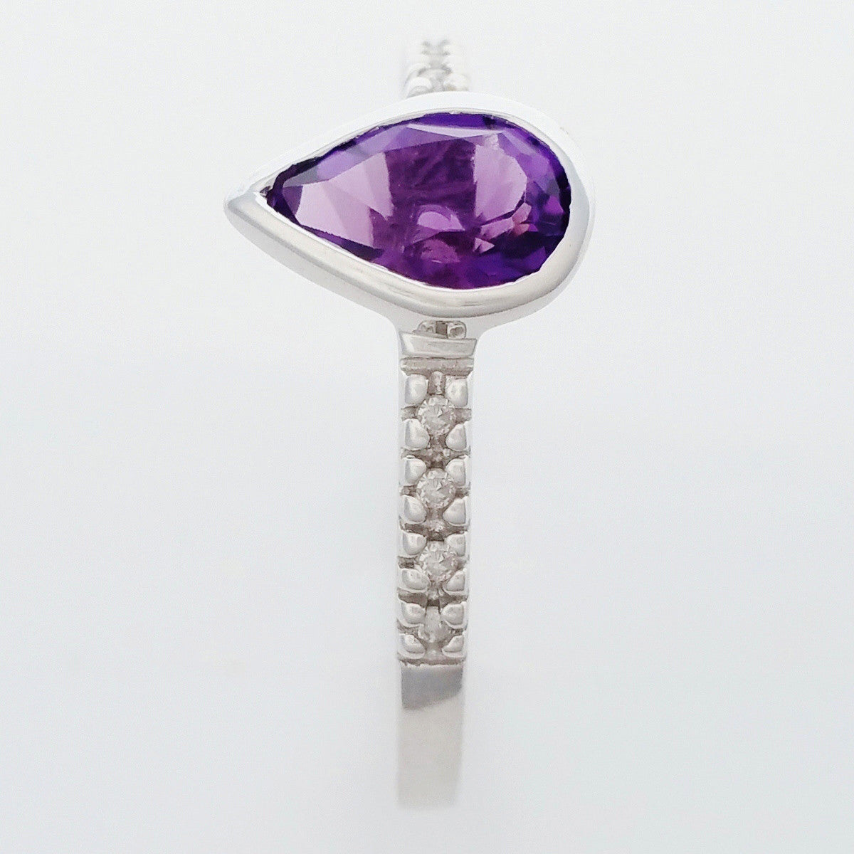 9K SOLID WHITE GOLD 0.70CT NATURAL PEAR CUT AMETHYST RING WITH 8 DIAMONDS.