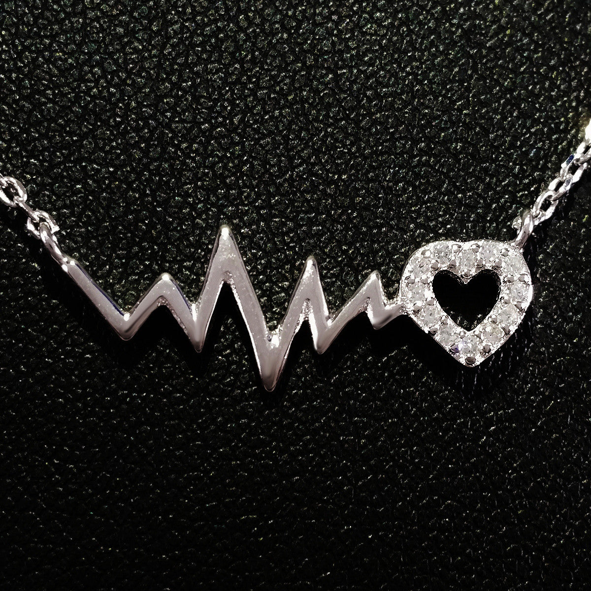 925 STERLING SILVER NECKLACE WITH EKG HEARTBEAT AND CRYSTAL LOVE-HEART PENDANT.