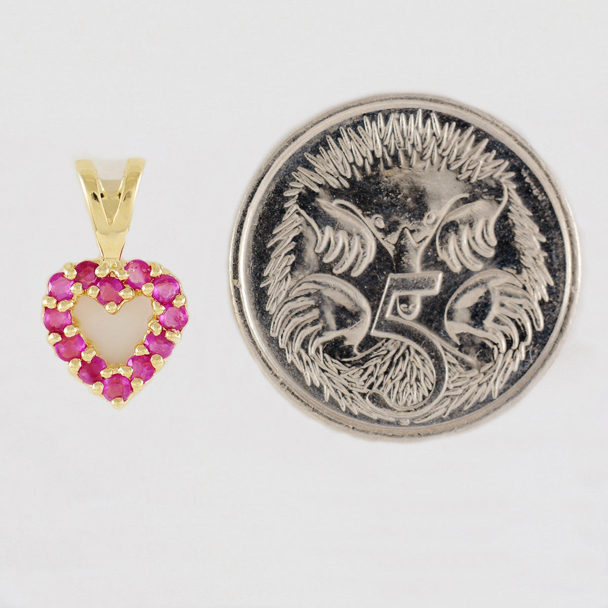 9K SOLID GOLD 0.30CT NATURAL RUBY OPEN HEART PENDANT.
