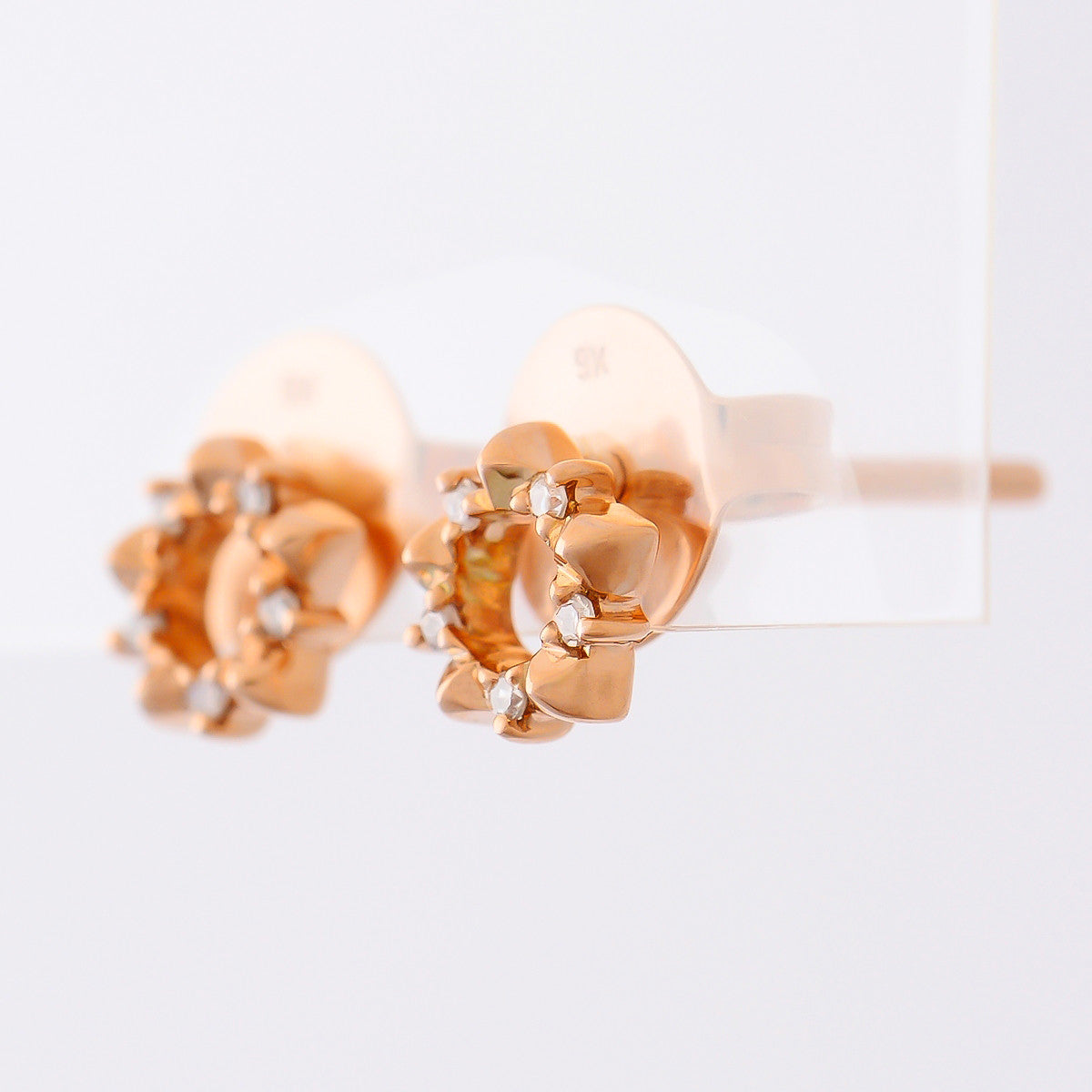 9K SOLID ROSE GOLD STAR SHAPE STUD EARRINGS WITH 10 DIAMONDS.