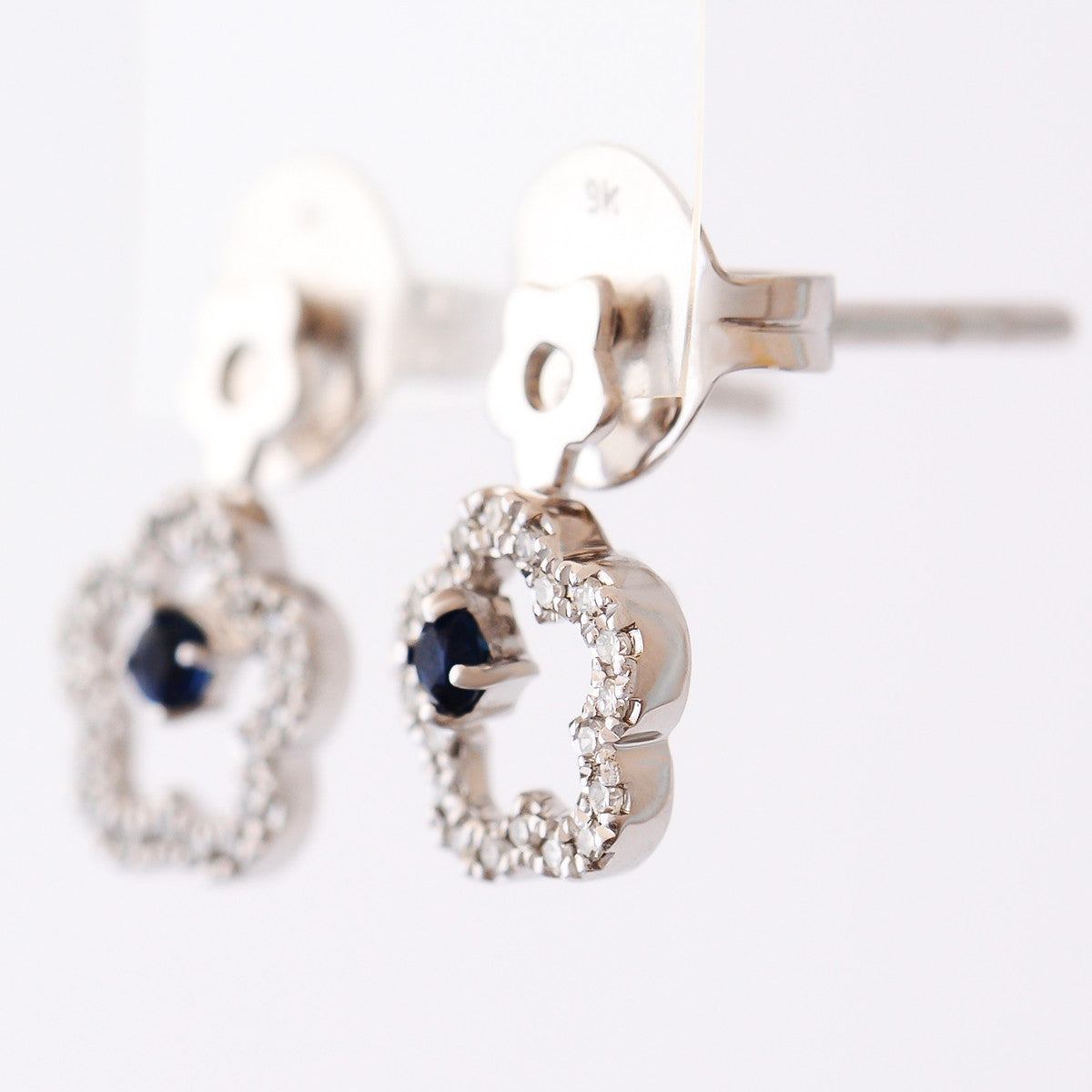 9K SOLID WHITE GOLD FLORAL INSPIRED NATURAL SAPPHIRE EARRINGS WITH 40 DIAMONDS.